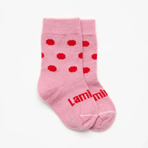Lamington baby merino crew socks in soft pink with cherry red spots made in New Zealand.