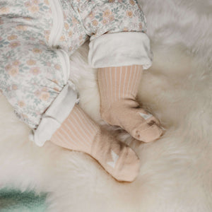 Organic Cotton Baby Socks in Oatmeal on tiny feet, perfect for little adventures, soft and cozy.