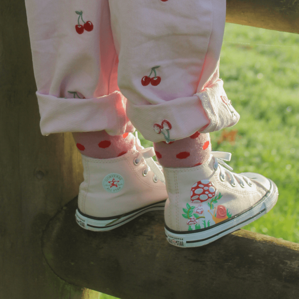Merino Wool Crew Socks for Child in Cherry color with red spots on a vintage pink base