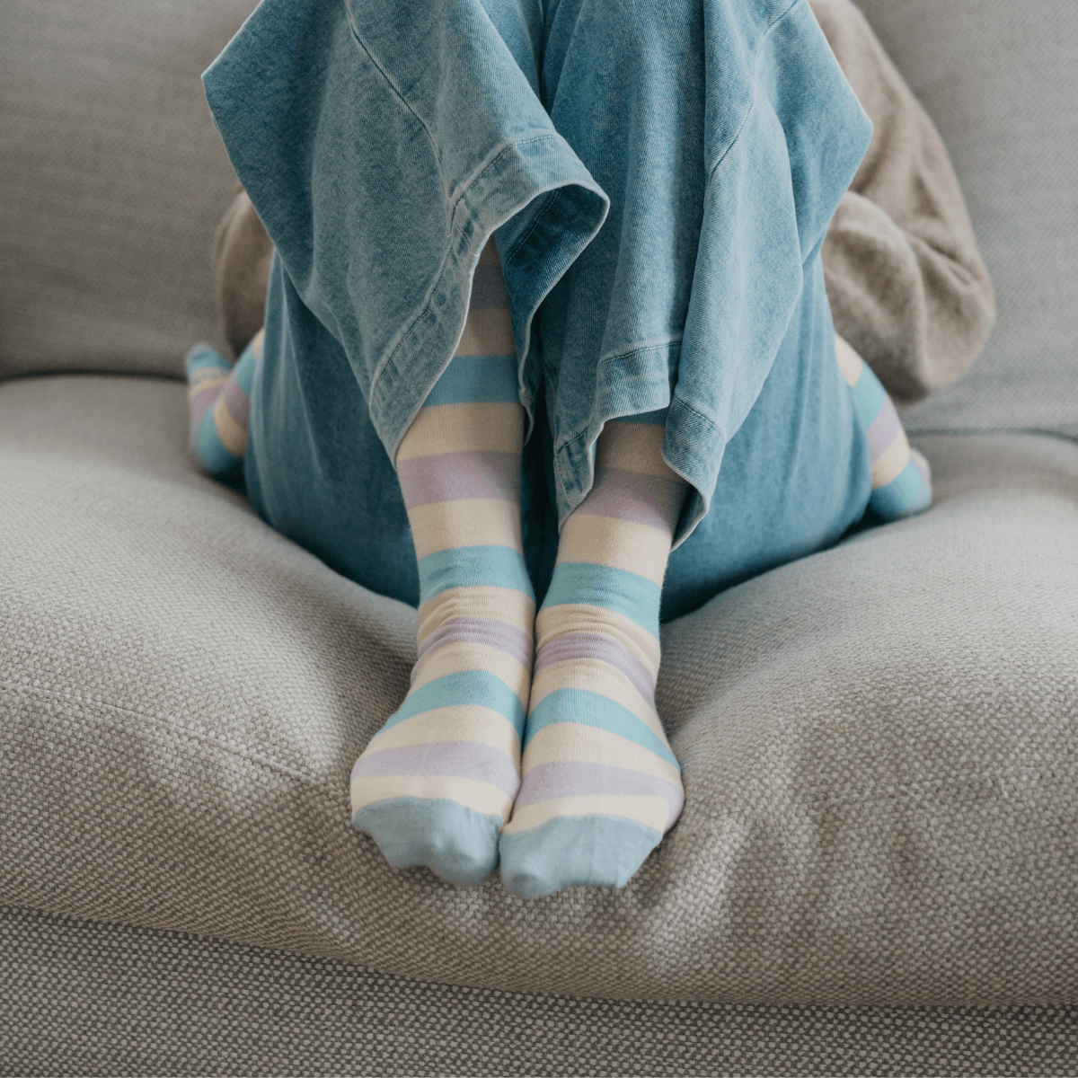 Merino Wool Knee High Socks for Woman in pastel blue, yellow, green and purple stripes, perfect for colder months.