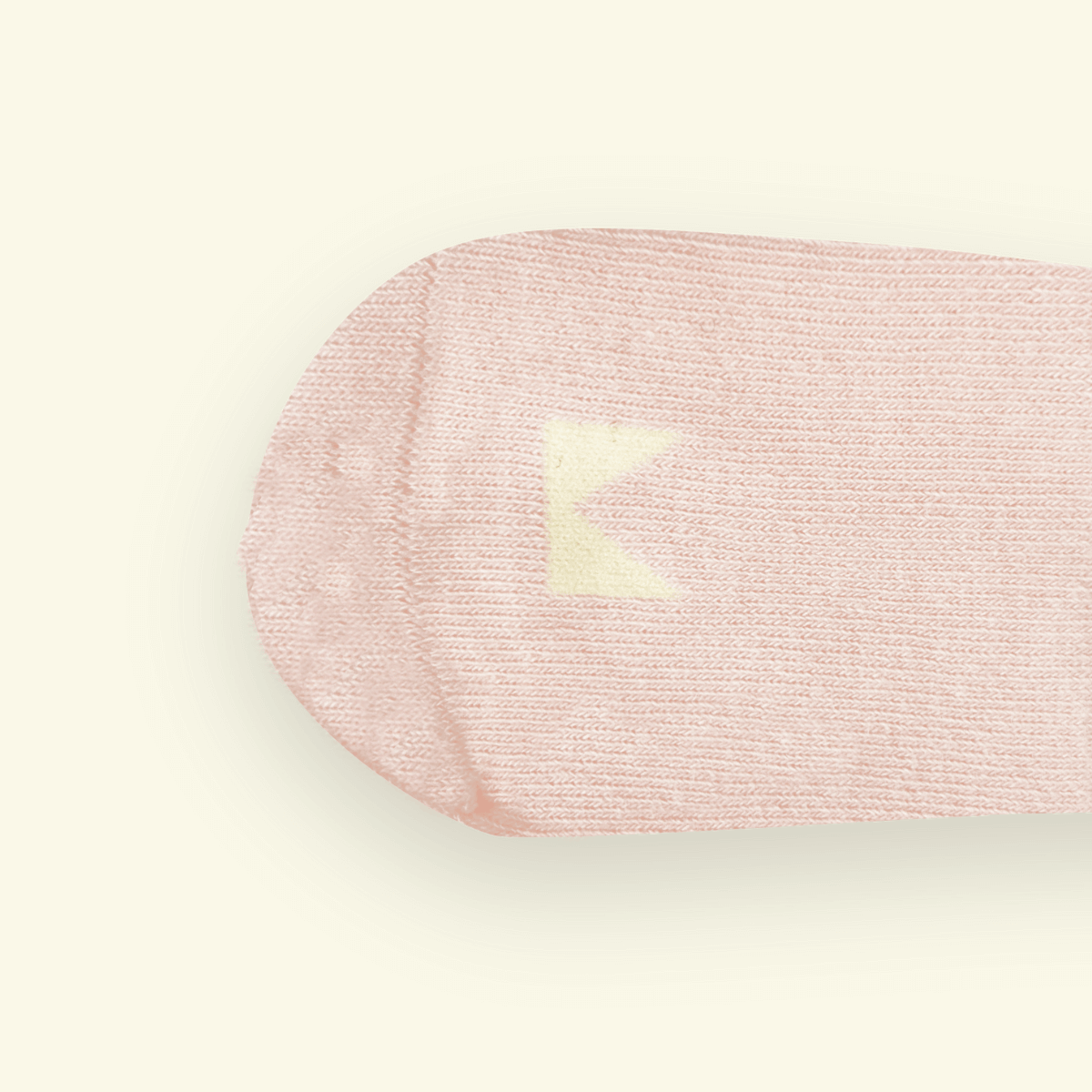Soft blush Organic Cotton Baby Socks with a cozy ribbed design, perfect for tiny feet.