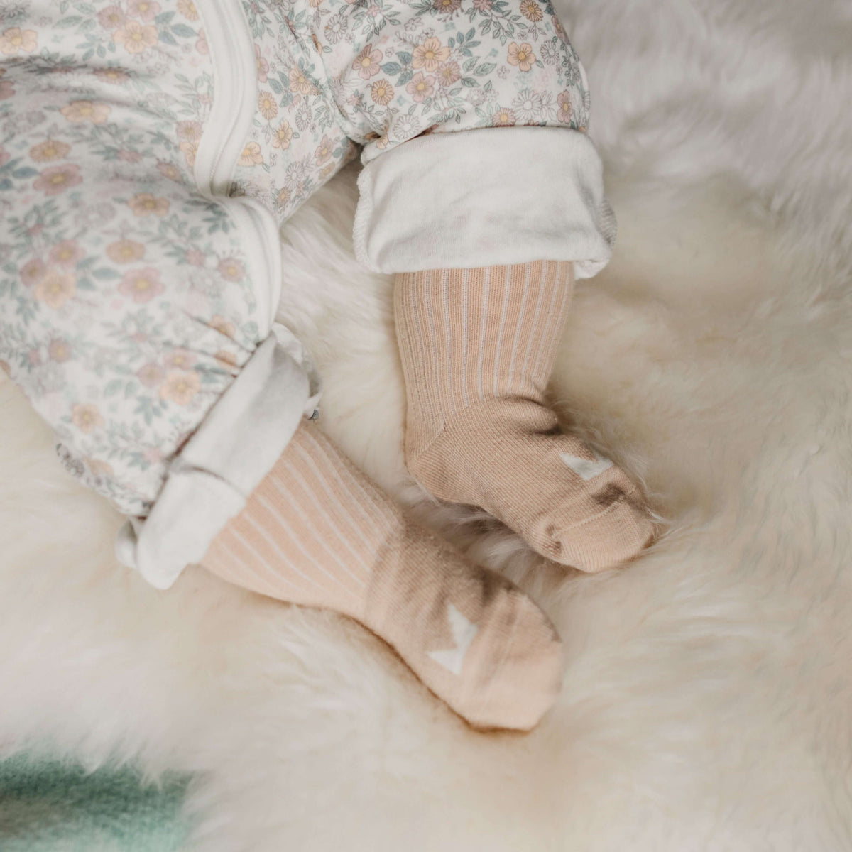 Organic Cotton Baby Socks in Oatmeal on tiny feet, perfect for little adventures, soft and cozy.