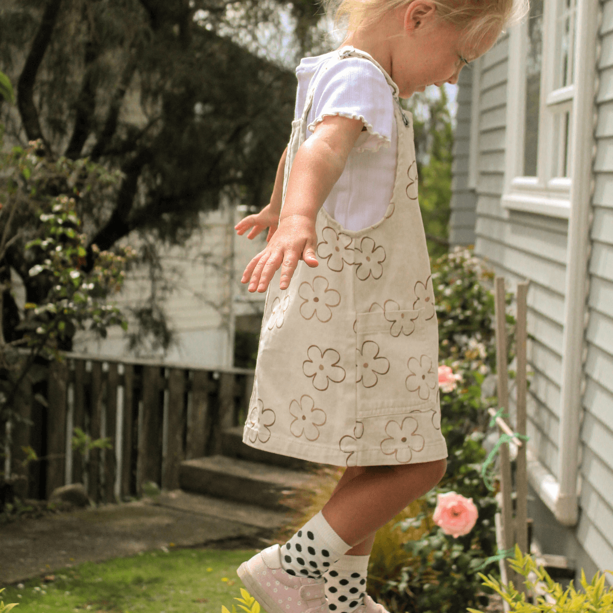 child wearing merino wool crew socks natural with green spots nz