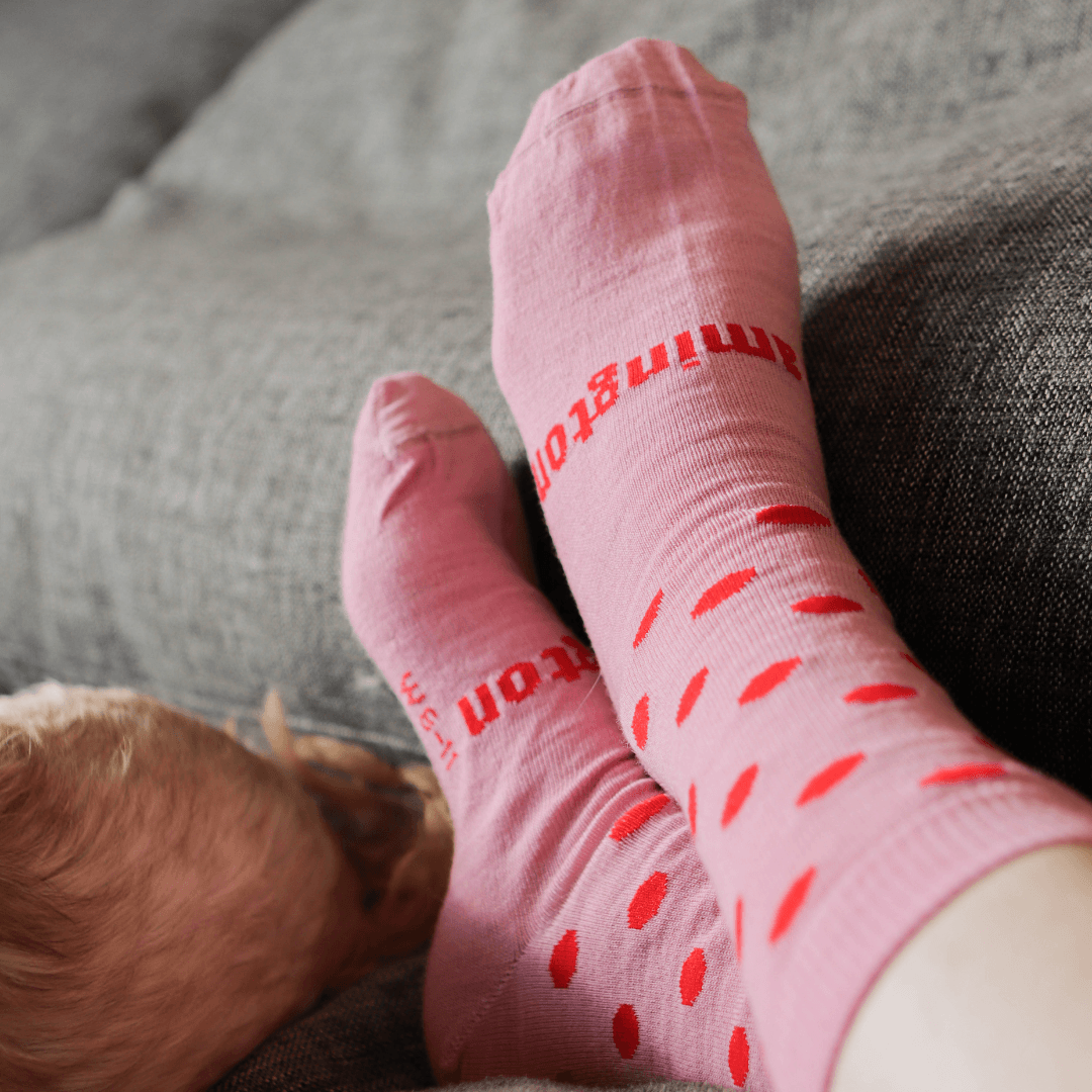 Merino Wool Crew Socks for Child in Cherry color with red spots on a vintage pink base