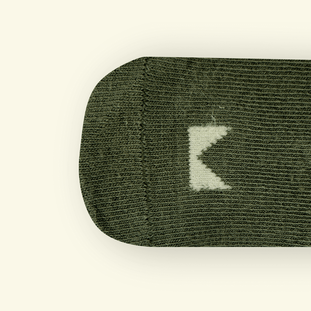 Top view of Sage Organic Cotton Baby Socks highlighting the textured fabric and Mosey logo detail.