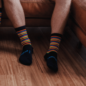 man wearing merino wool crew socks rainbow stripes nz